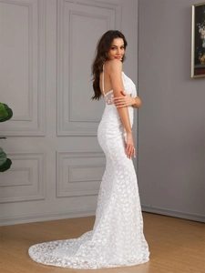 Elegant white floral lace fishtail dress with thin straps and a long flowing train