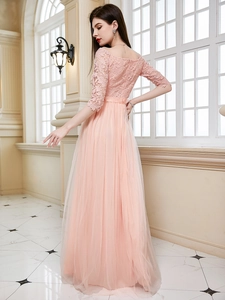 Elegant pink off-shoulder evening gown with floral lace bodice and layered tulle maxi skirt