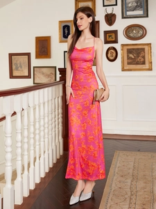 Detail view of the elegant cowl neck and vibrant floral satin print on this slim maxi dress