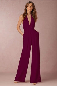 Detailed side view of deep purple halter neck jumpsuit with elegant wide-leg cut and pockets