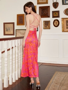 Elegant rose red floral maxi dress with cross back straps and orange flower patterns
