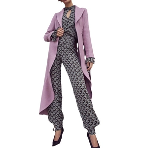 Women's lavender long wool coat paired with geometric print jumpsuit for urban fashion