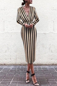 Detail of deep V-neck and slimming vertical stripe pattern on a long-sleeve midi dress