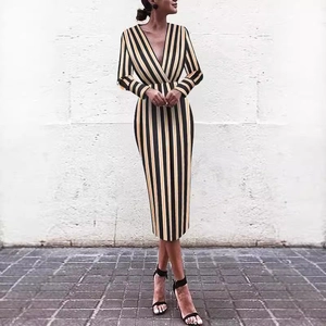 Women's deep V-neck long sleeve striped midi dress in yellow, black, and white