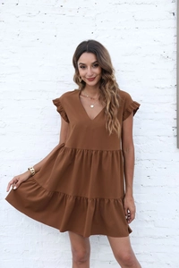 Detail of tiered skirt and ruffle sleeves on this brown V-neck short sleeve dress