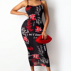 Detail of graffiti print with Love text and red hearts on black midi dress fabric