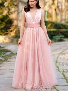 Elegant pink halter evening dress with deep V-neck, pearl beadwork and layered mesh skirt