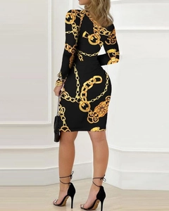 Detail of slim fit mini dress with gold baroque chain print and long sleeves