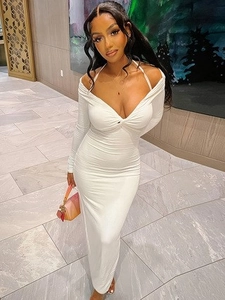 Detail of white off-shoulder bodycon maxi dress with cutout neck and long sleeves