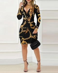 Women's V-neck long sleeve mini dress in black with gold baroque chain print pattern