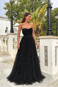 Detail of strapless slim fit black maxi dress featuring colorful sparkling sequins