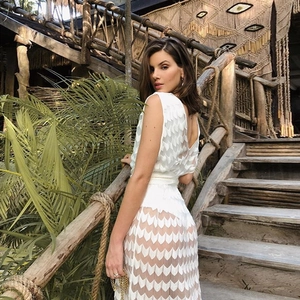 White bohemian V-neck hollow out dress with see-through pattern for summer beach vacations
