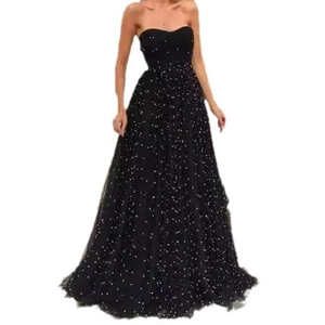 Elegant strapless high-waisted black evening gown with sparkling star-like sequins decoration