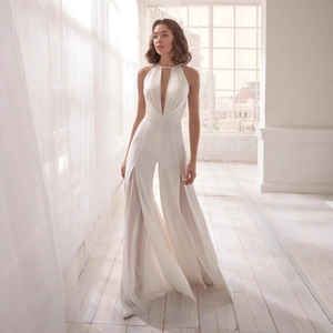 Elegant white satin halter v-neck jumpsuit with wide leg side slits for weddings