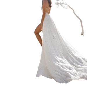 Elegant white sequin evening gown with a high slit and a long dramatic trail