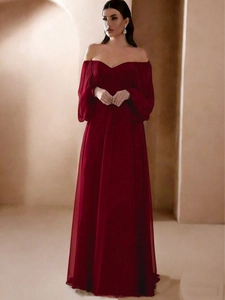 Elegant off-shoulder burgundy evening gown with lantern sleeves and a flowing floor-length hem