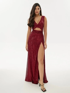 Detail of burgundy sequin evening dress with deep V-neck, waist cut-outs and side slit