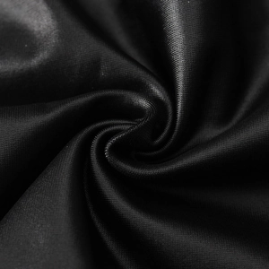 Macro shot of smooth black synthetic fabric texture showing high luster and fine weave