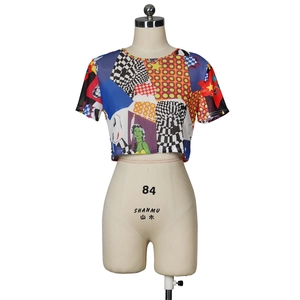 Detail view of mesh crop top with colorful pop art print and sheer fabric texture