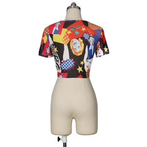 Detailed close-up of colorful pop art print on women's slim fit cropped mesh top