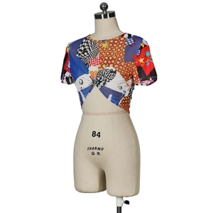 Detail of cropped mesh T-shirt with vintage collage print and front twist knot design