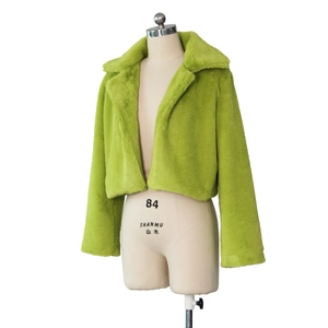 Close-up of bright lime green faux fur jacket featuring a large collar and soft texture