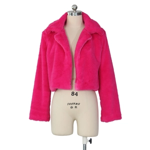 Detailed view of plush hot pink faux fur texture and large lapel of this cropped jacket