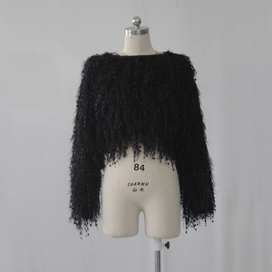 Detail of black cropped plush sweater with sparkling sequins and round neck design
