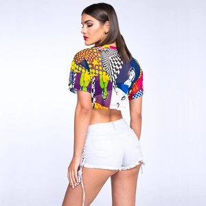 Detail of crop top with pop art print and white denim shorts with side drawstrings