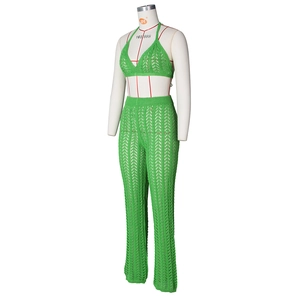 Detail showing the intricate wave-pattern crochet knit of the green halter top and pants