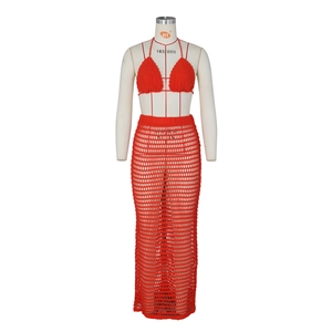 Close-up of red crochet knit texture and intricate mesh details on the beach skirt