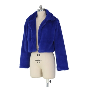 Detailed texture of royal blue faux fur jacket with fluffy wide collar and long sleeves