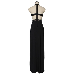 Detailed back view of black evening dress with eyelash lace and silver metal zipper
