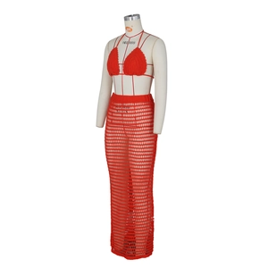 Detail of red crochet knit bikini top and sheer hollow out beach skirt set