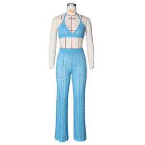Detail of sky blue crochet knit two-piece set featuring wave texture and openwork patterns