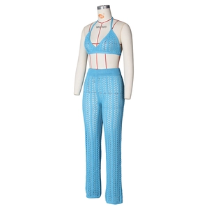 Detailed knit texture of bright blue two-piece crochet set with hollow out pattern