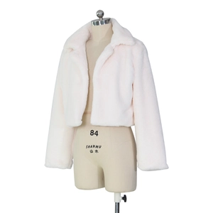 Close-up of soft light pink faux fur texture and large collar on short jacket