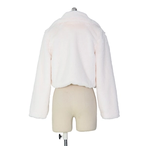 Detail view of the thick plush texture on this white faux fur short cardigan jacket