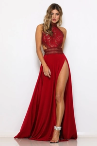 Detail of red lace bodice and high-slit satin skirt on a formal evening dress