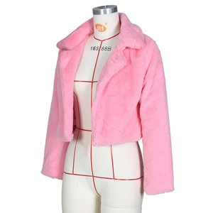 Detail shot of pink faux fur short jacket featuring long fluffy texture and lapel collar