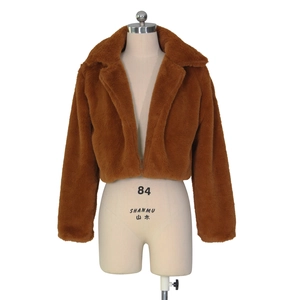 Detailed view of caramel faux fur jacket with fluffy texture and oversized wide lapels