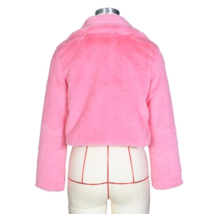 Back view of a pink faux fur short jacket showing plush texture on a display mannequin