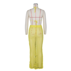 Detail of yellow crochet knit halter top and hollow out skirt back view on mannequin