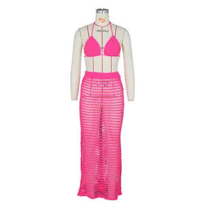 Detail showing the fluorescent pink hand-crocheted bikini top and mesh knit maxi skirt