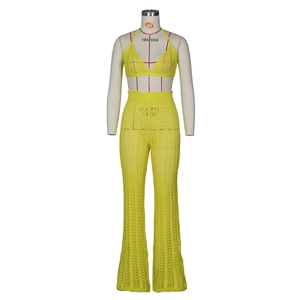 Detailed texture of bright yellow crochet knit set with hollow mesh pattern design