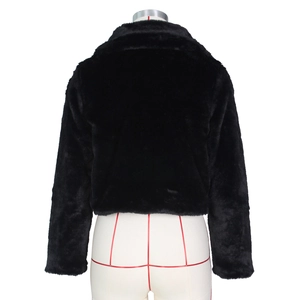 Detail view of the back of a black faux fur jacket with dense texture and sleek stand collar