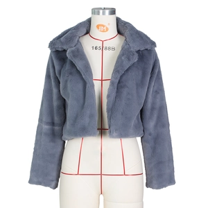 Close-up of luxury dark grey faux fur texture on a stylish short cropped cardigan jacket