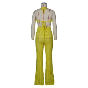 Detailed back view of yellow crochet knit two-piece set featuring openwork texture