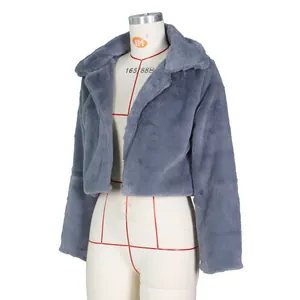 Detail of grey faux fur short jacket showing plush texture and classic collar on mannequin