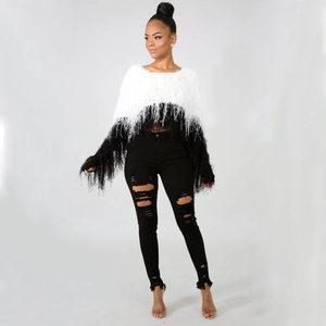 Women's black and white shaggy knit sweater with fringe details and long sleeves